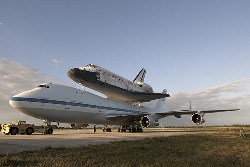 NASA Discovery shuttle pictured mounted on a modified Boeing 747 carrier at the Shuttle Landing Facility at NASA's Kennedy Space Center in Florida before its final flight to the Smithsonian today. The shuttle will be placed on display in the Smithsonian's National Air and Space Museum Steven F. Udvar-Hazy Center. Image credit: NASA/Tim Jacobs