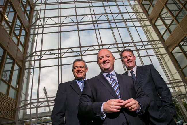 Riccardo Brizzi, chief operating officer, SQS Group; Phil Codd, managing director, SQS Ireland; and Dik Vos, CEO, SQS Group; pictured at the company's new offices in the Dublin Docklands this morning. SQS's Irish operation has its sights set on creating 75 jobs over the coming three years - at both its Dublin and Belfast hubs. Image credit: Naoise Culhane Photography 