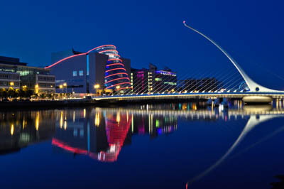 Night-time vista of the Samuel Beckett Bridge, Dublin, which spans the River Liffey, with The Convention Centre Dublin in the background. The photo is available on Lokofoto.com. Photographer: Paul Sweeney