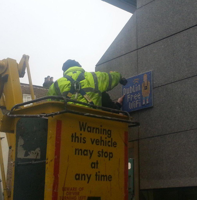View of a mosaic tile advertising the free Wi-Fi being placed on a Dublin City building. Credit: @DigiDublin