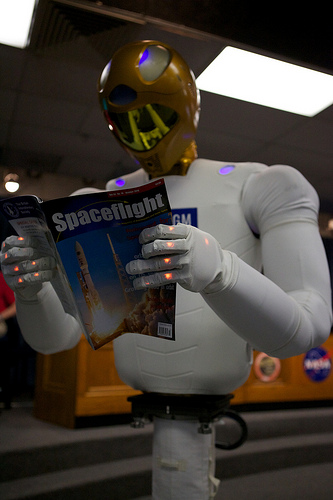 Robonaut R2 reading Spaceflight magazine