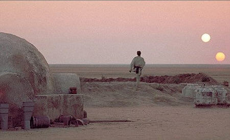 Luke Skywalker looking at the two suns set on Tatooine