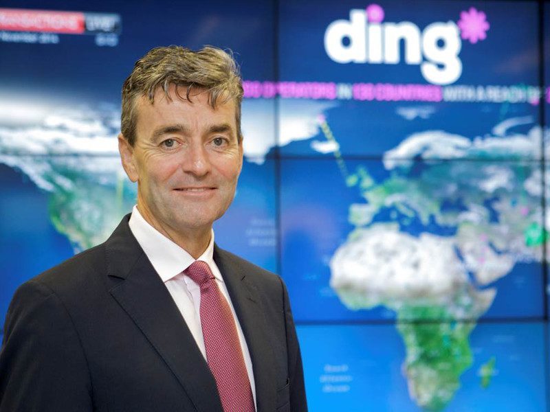 Picture of Ding founder Mark Roden in front of a global map.