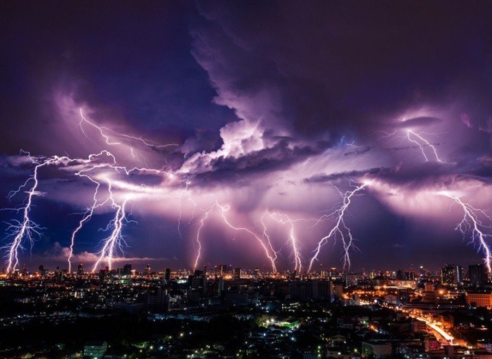 Google: lightning strike over city against purple sky