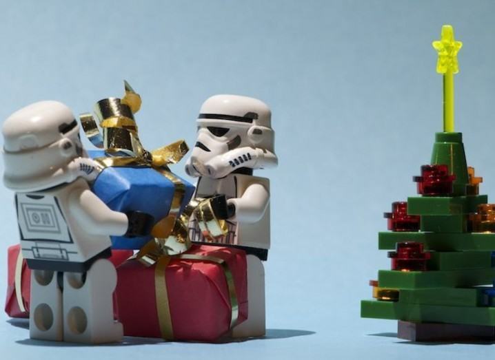Lego Star Wars stormtroopers stacking gifts next to tree