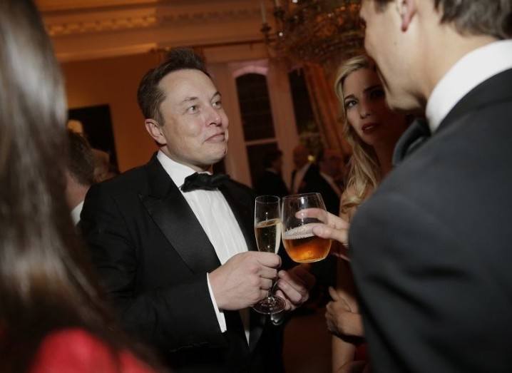Elon Musk sipping champagne at a party.