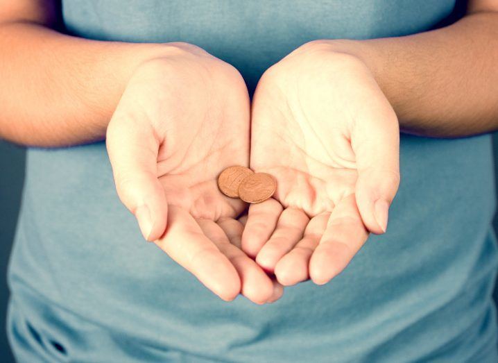 Maths: woman holding pennies
