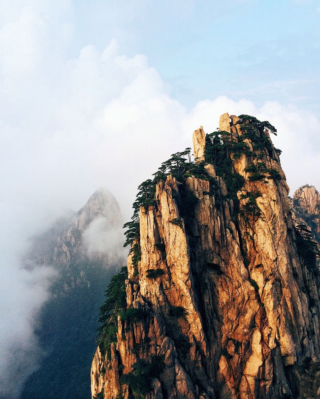 Yang Zhang en route to Yellow Mountain – “As I was climbing some slippery rocks the clouds suddenly parted and sunshine came onto the cliff in front of me. It was a magical moment that unfolded like a scene from a traditional Chinese painting.”