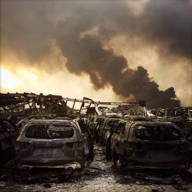 Liang Huang’s scene of devastation – “On August 12, 2015, a series of explosions happened in the toxic goods depot of Ruihai company located in Tianjin port […]. After 1 hour, when ashes of burned goods were still falling like black snow, I was in position at ground zero.” IPPAWARDS iPhone