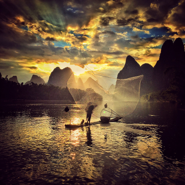 Yongmei Wang took second spot in the Sunset category – “When I arrived in the village Xingping, I was deeply attracted by the natural scenery, the river, the mountain, the bamboo and the tranquility. I rented a bicycle and idled along the Li River the whole afternoon, talking with the local people and taking pictures.”