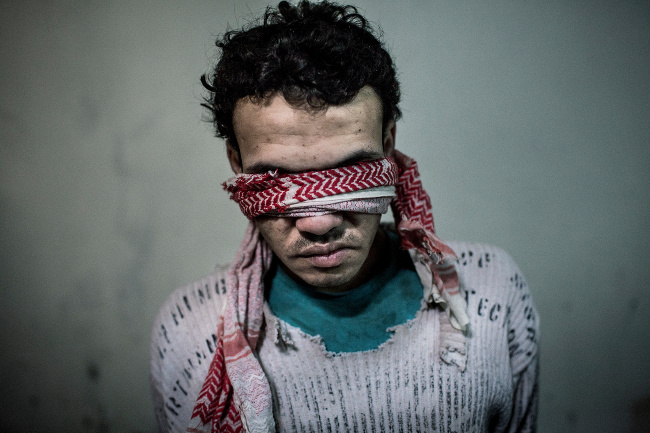 Kurdish YPG militia arrested this man in the northeastern part of Syria – image via Asger Ladefoged, open single image winner at Magnum and LensCulture Photography Awards 2016