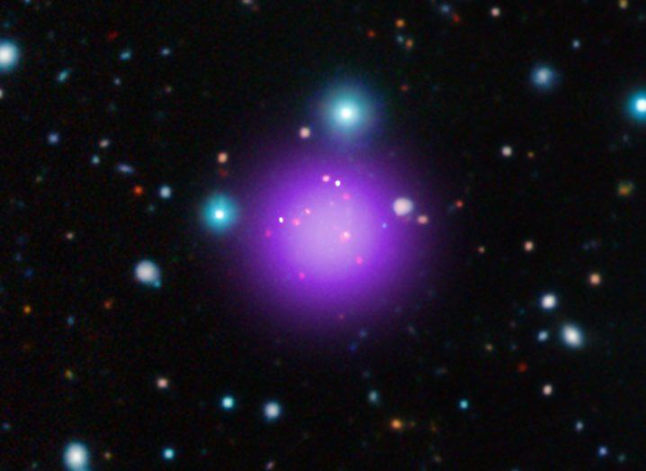 Galaxy Cluster CL J1001 is the most distant of its kind ever recorded. Image via NASA/CXC/CEA/T. Wang et al (X-ray); ESO/UltraVISTA (Infrared); ESO/NAOJ/NRAO/ALMA (Radio)