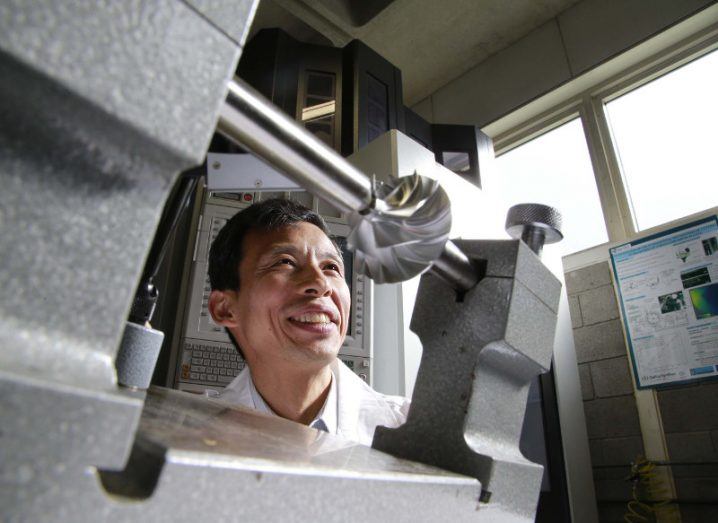 A man working in a lab on precision manufacturing. He is Prof Fengzhou Fang.