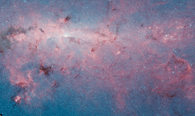 The Milky Way as seen at shorter wavelengths, and seen through traditional light, thus obscuring some structures from view. Image: ESO/ ATLASGAL/NASA/GLIMPSE/VVV/ESA/Planck/Minniti/Guisard