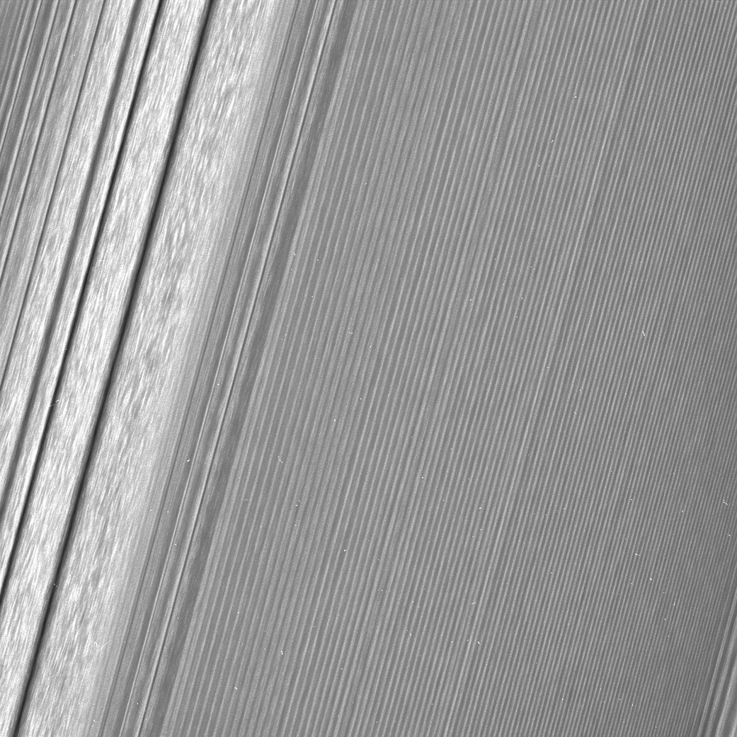 This image features a ‘density wave’ in Saturn’s A ring (at left) that lies around 134,500 km from Saturn. These waves are filled with clumpy perturbations, which researchers informally refer to as straw. This wave is created by the gravity of the moons Janus and Epimetheus, which share the same orbit around Saturn. Image: NASA/JPL-Caltech/Space Science Institute