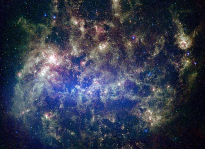 This vibrant image from NASA’s Spitzer Space Telescope shows the Large Magellanic Cloud, a satellite galaxy to our own Milky Way galaxy. It is included in NASA’s new library. Image: NASA/JPL-Caltech/STScI