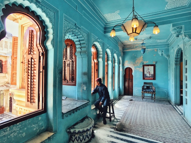 Kuanglong Zhang, China. 3rd place, photographer of the year category, IPPA. “Udaipur is one of the most romantic cities in India. in the City palace, I snapped a moment of one of the staff gazing out of the window as if he saw the slowly historic course of the palace’s construction, which was as quite attractive moment.” 