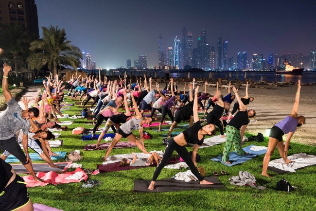 Full moon yoga session, Dubai, September 2016. Full moon yoga session at Fairmont The Palm Hotel and Resort in Dubai. Image: Nick Hannes, Documentary Series Winner, Magnum and LensCulture Photography Awards 2017.