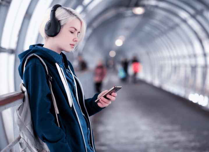 woman listening to music. YouTube is entering the music streaming market.