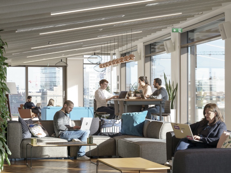 Stripe workers in a nicely lit working environment overlooking Silicon Docks.