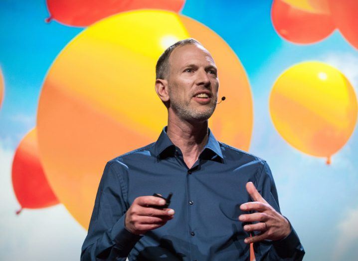 Tim Leberecht on backdrop of coloured balloons. Image: TEDx
