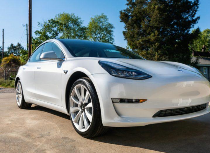 White Tesla Model 3 vehicle parked outdoors