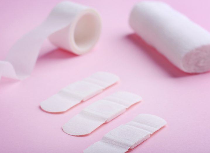 bandages and gauze on a pink background