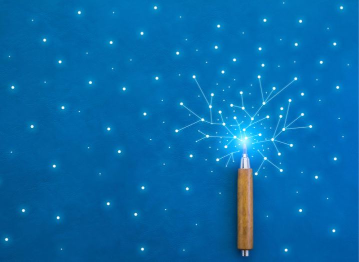 Lines from a wooden pencil connect bright dots on a blue texture background