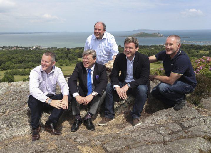 From left: Gavan Walsh, founder & CEO; Michael Tope, managing director; Niall O'Callaghan, technical Director and co-founder; Elmo the dog; Niall Prenty, business development director; and Bob Nixon, sales director and co-founder. Image: Conor McCabe