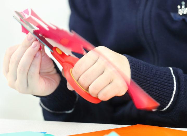 Person using a left-handed scissors