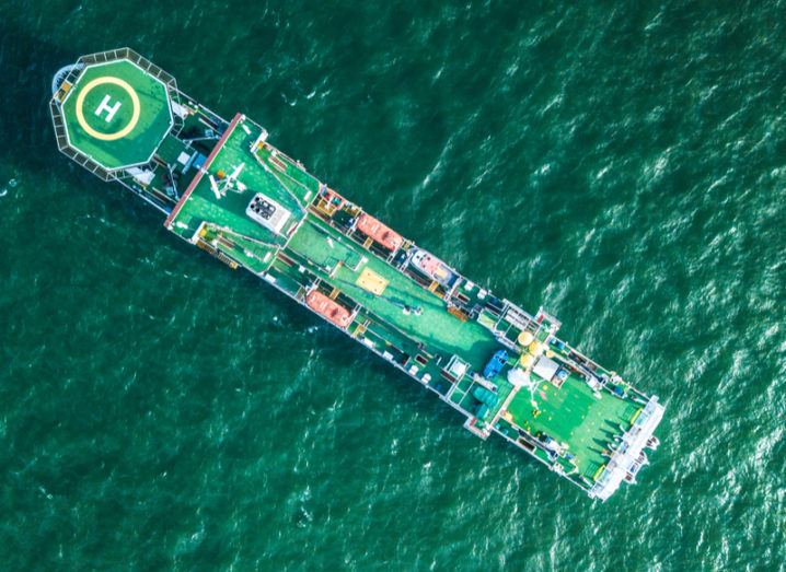 birds-eye view of a subsea cable installation boat on the water