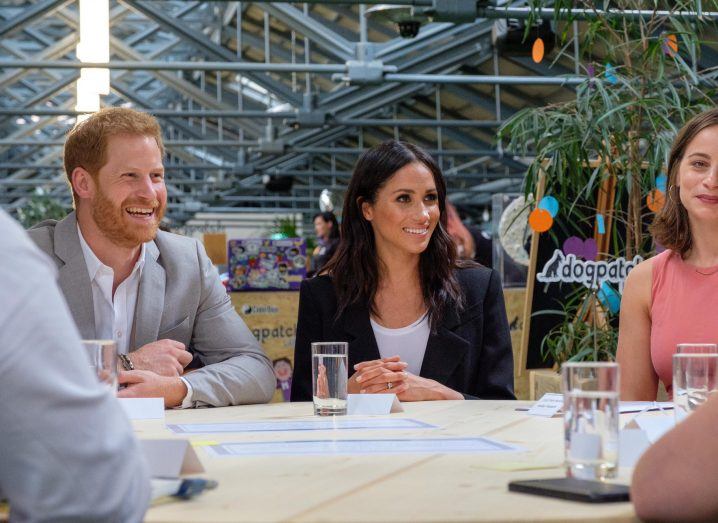 Prince Harry and Meghan Markle smile at the round table discussion in Dogpatch Labs
