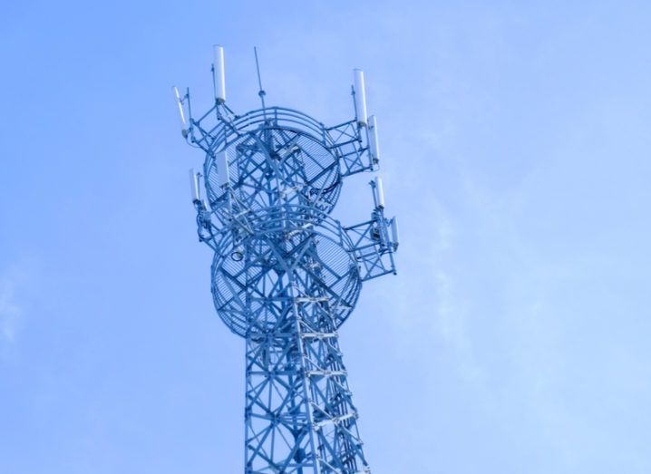 Mobile phone tower against blue sky