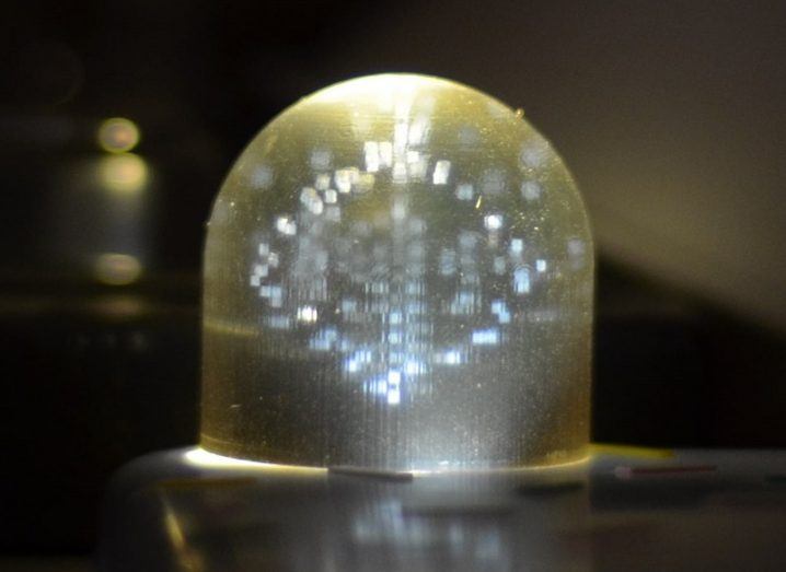 A clear 3D-printed dome containing a variety of dummy and real QR codes.