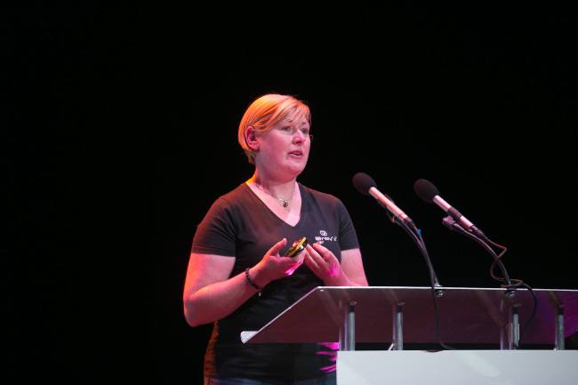 julie gray speaking on stage