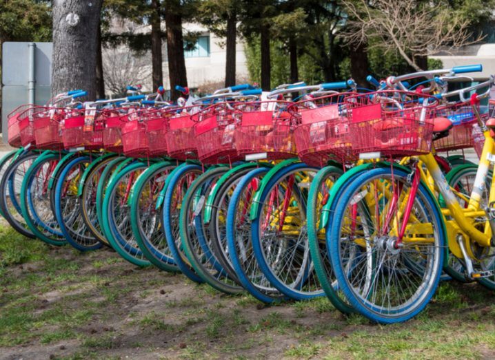A row of bicycles at the Google offices, painted in red, blue, green and yellow.