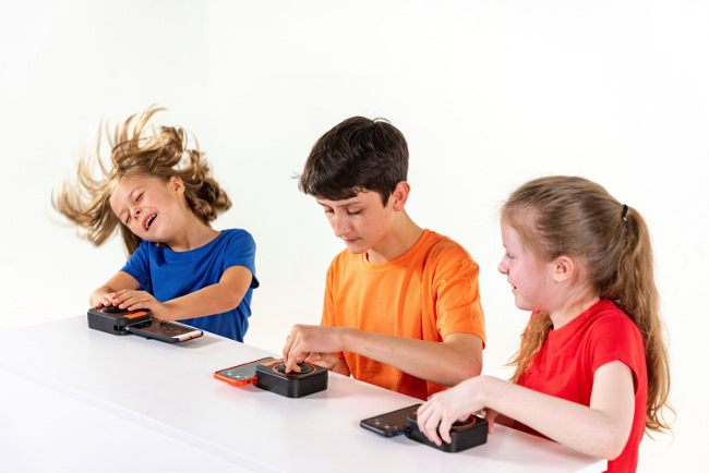 Children making music using their smartphones.