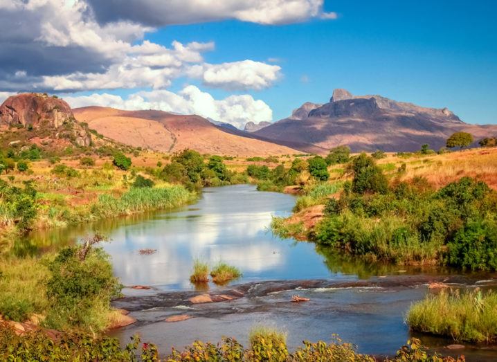 Landscape in Madagascar, orange mountains and blue skies.