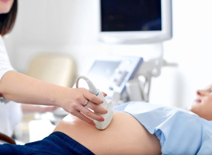 close-up of pregnant woman getting ultrasound scan.