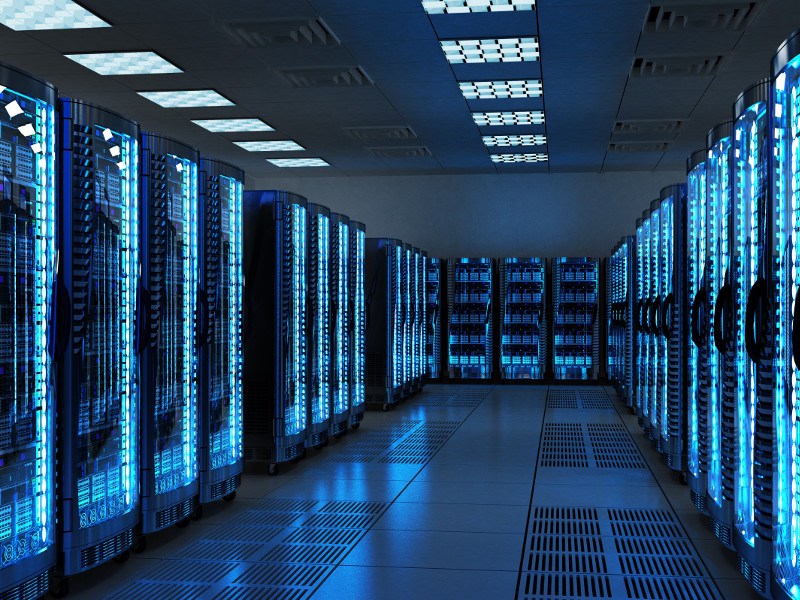 Inside of a data centre with servers and lights.