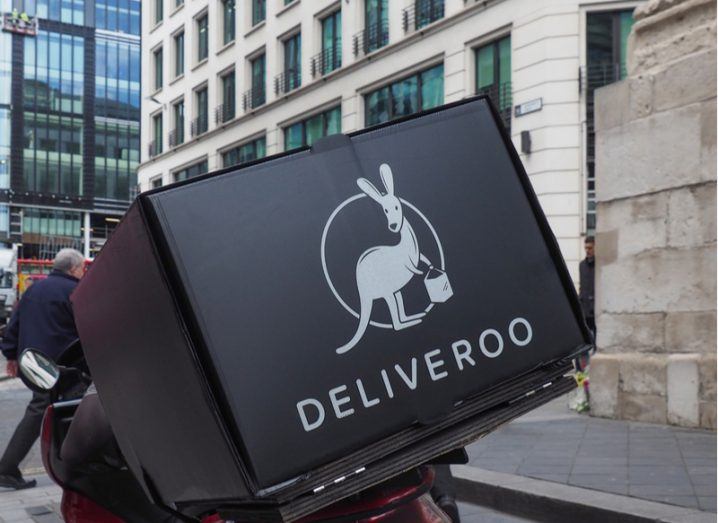 Black Deliveroo-branded box on the back of a rider.