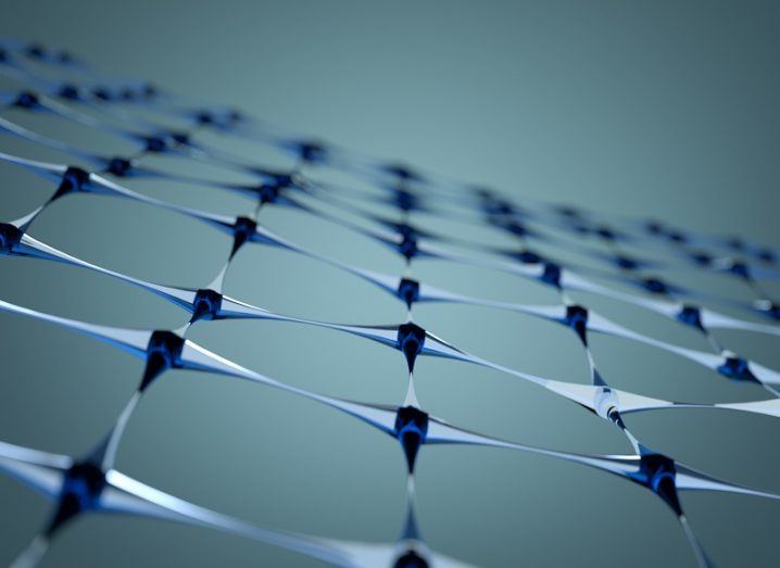 abstract graphene lattice in dark blue against grey background.