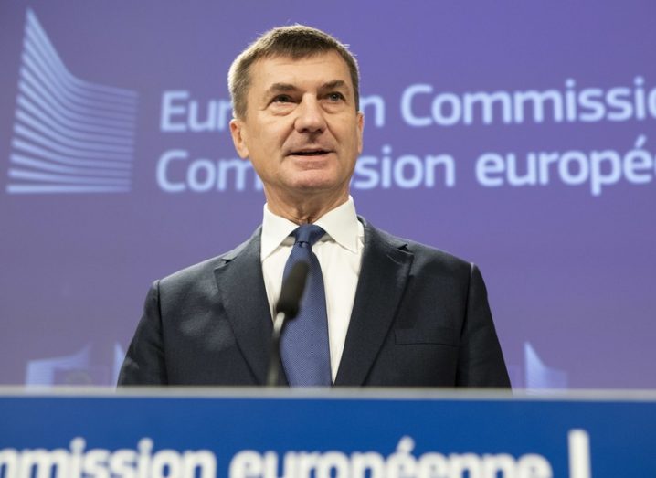 Andrus Ansip, wearing a dark suit, speaking at a European Commission press conference.
