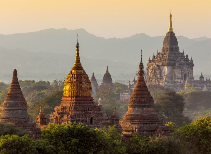 Buddhist temples in the Bagan area of Myanmar at sunrise.