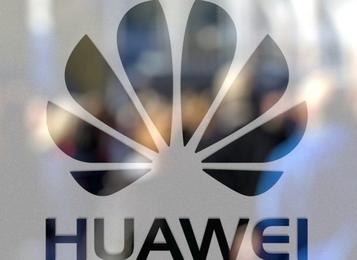 Huawei logo on frosted glass door.