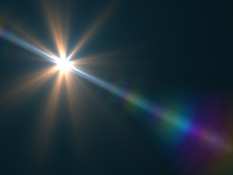 Lens flare against a black background representing a fast radio burst.