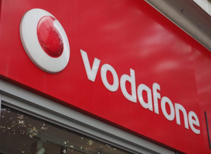 Vodafone logo on a storefront in its signature red and white colourway.