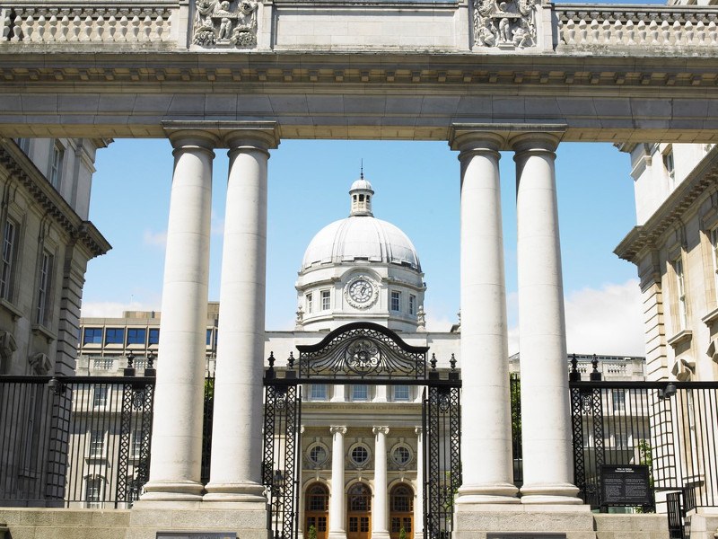 A picture of Irish Government buildings with the gates opened.
