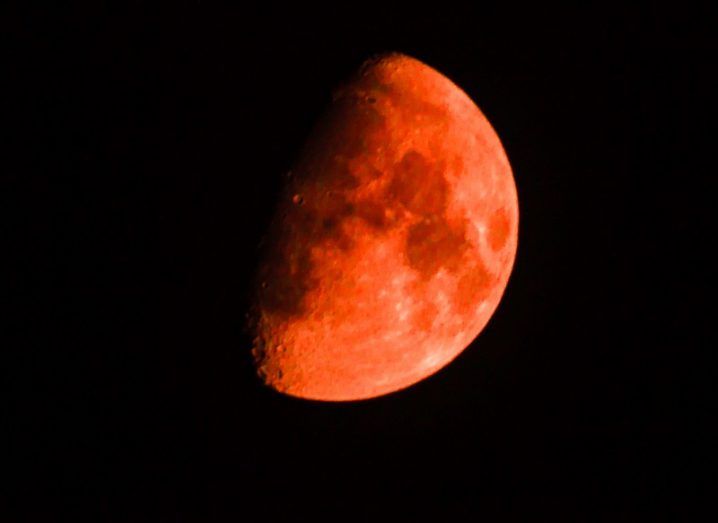 A large blood supermoon taking up the night sky.