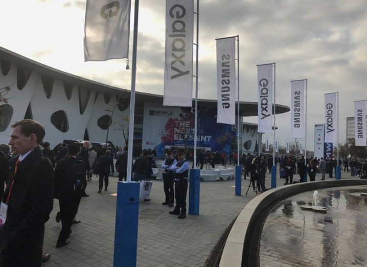 Crowds of people stand outside the Gran Fira in Barcelona at Mobile World Congress.